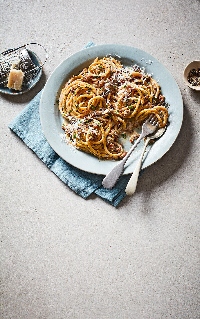Bucatini with mushrooms, sausage and grated cheese