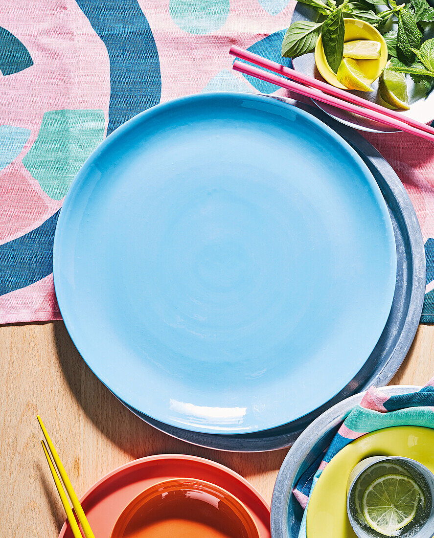 Light blue plate on a colourful background