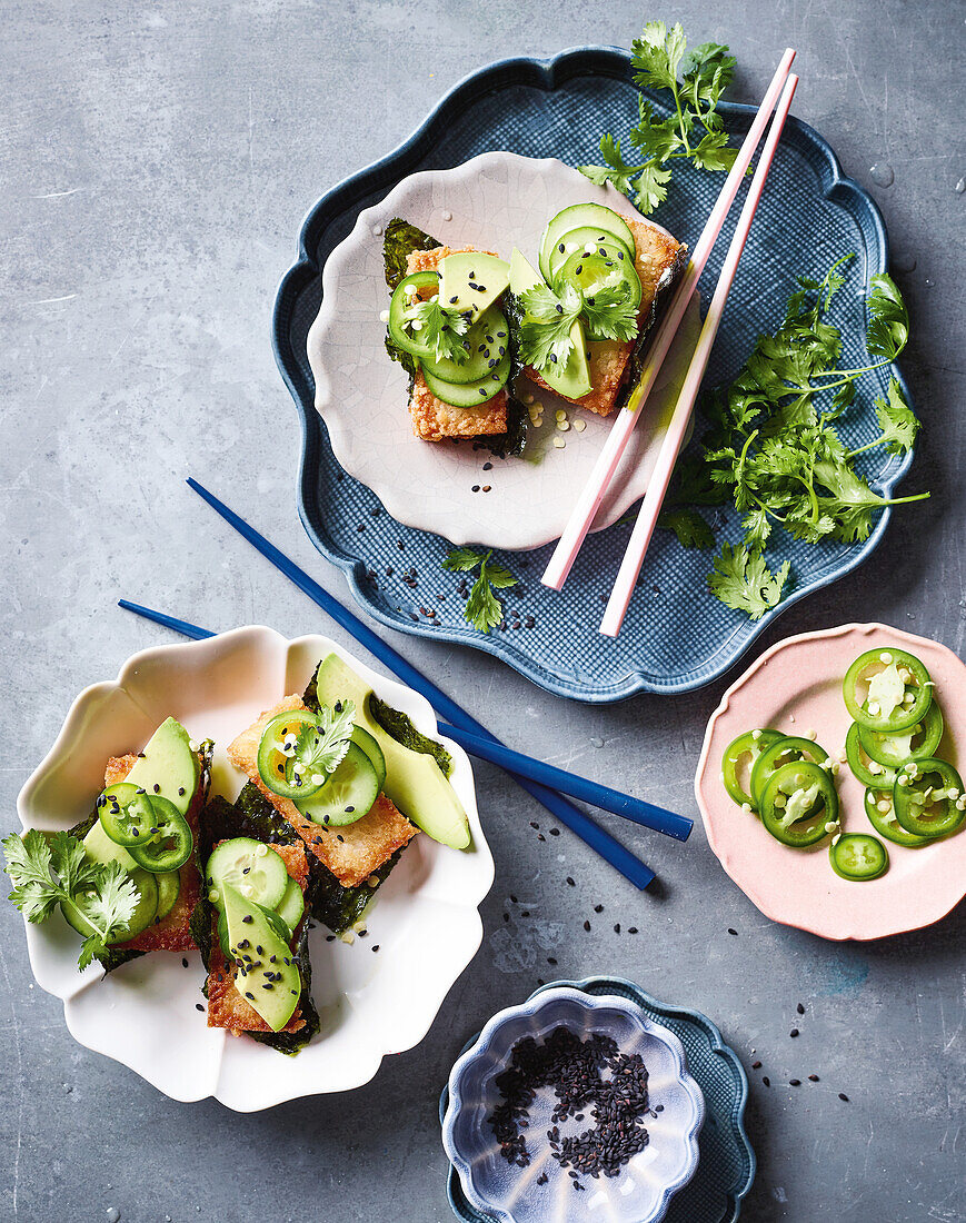 Crispy rice cakes with avocado and fresh herbs