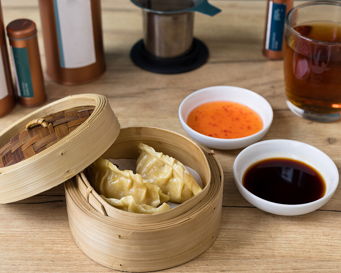 Steamed chicken dumplings with dipping sauces