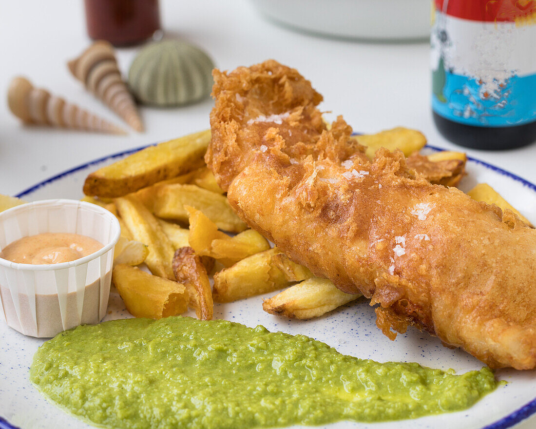 Fish and chips with pea puree and tartar sauce