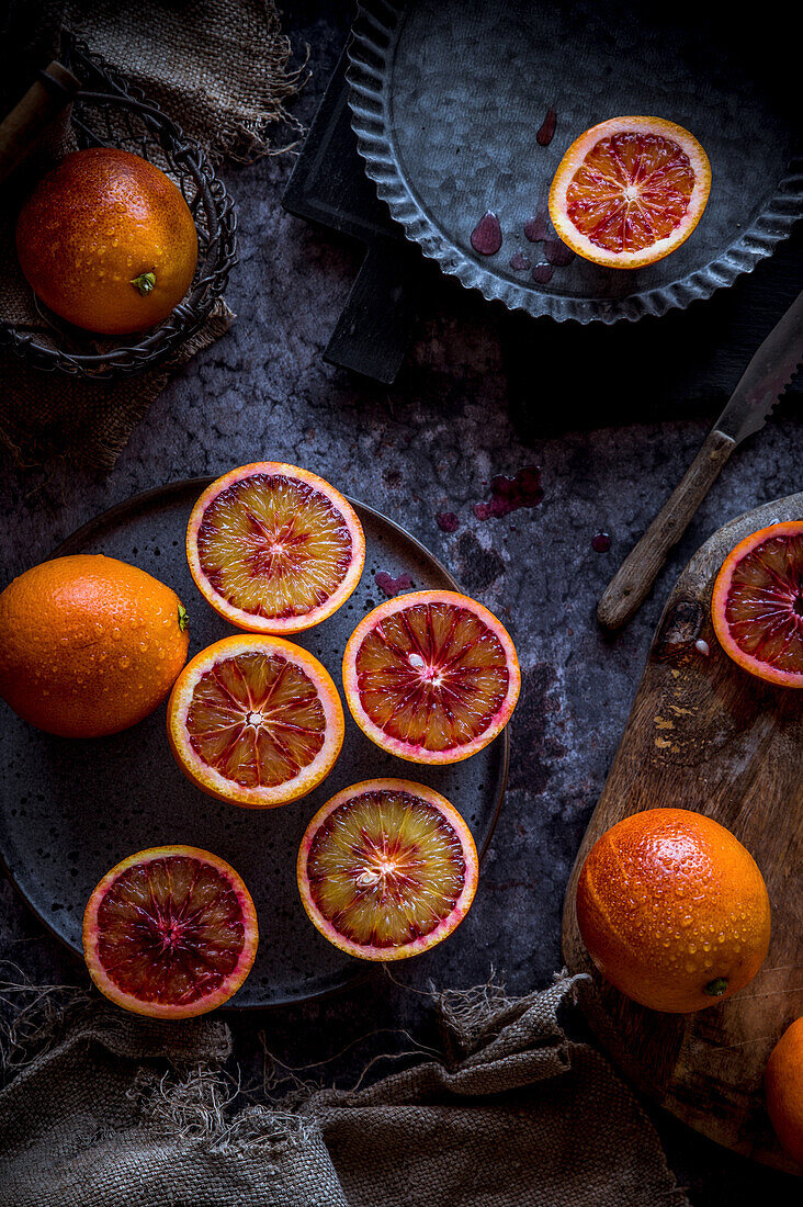 Whole and sliced blood oranges