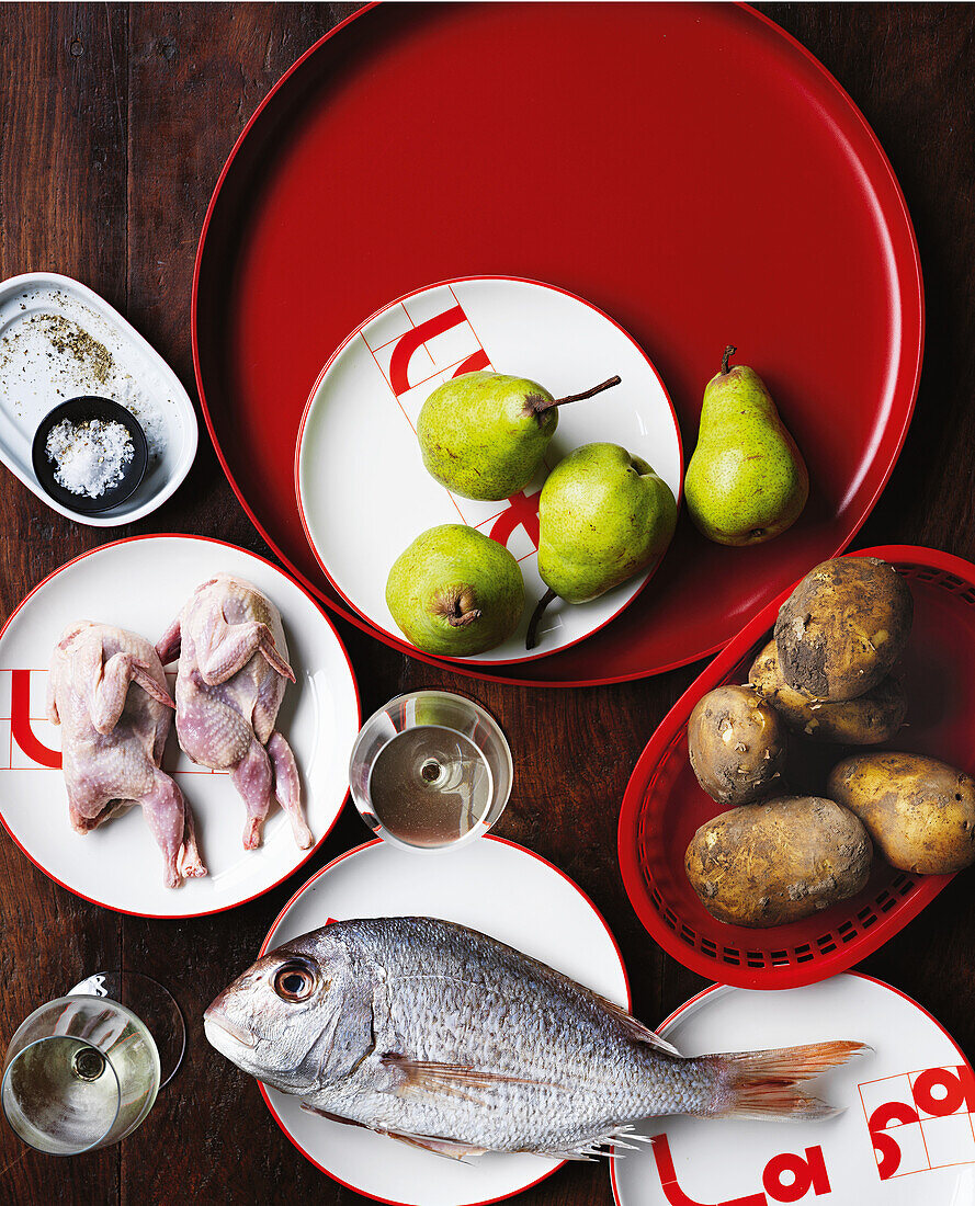 Still life with pears, potatoes, quail and snapper