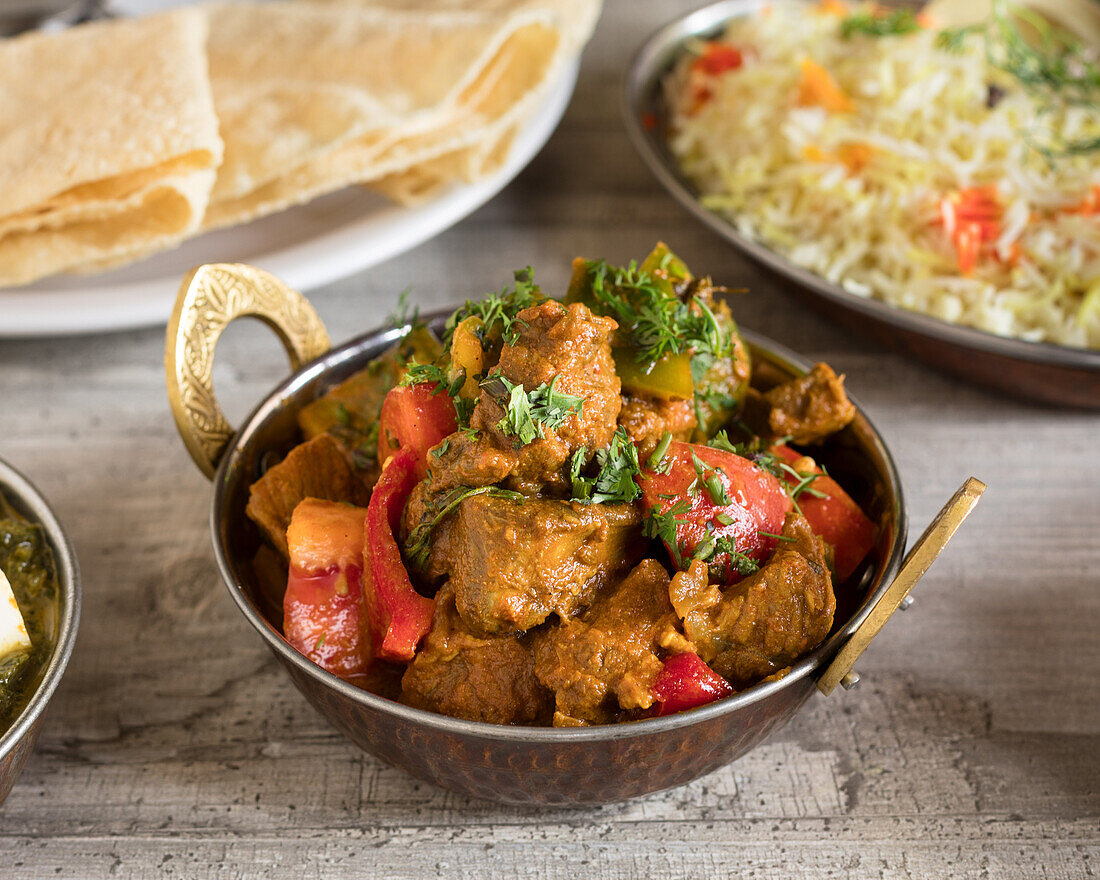 Lamb tikka masala with rice and papadam