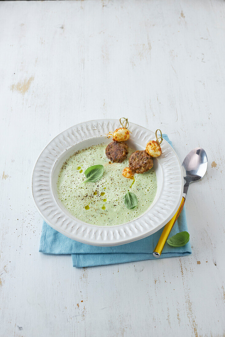 Courgette soup with veggie meatballs and mozzarella