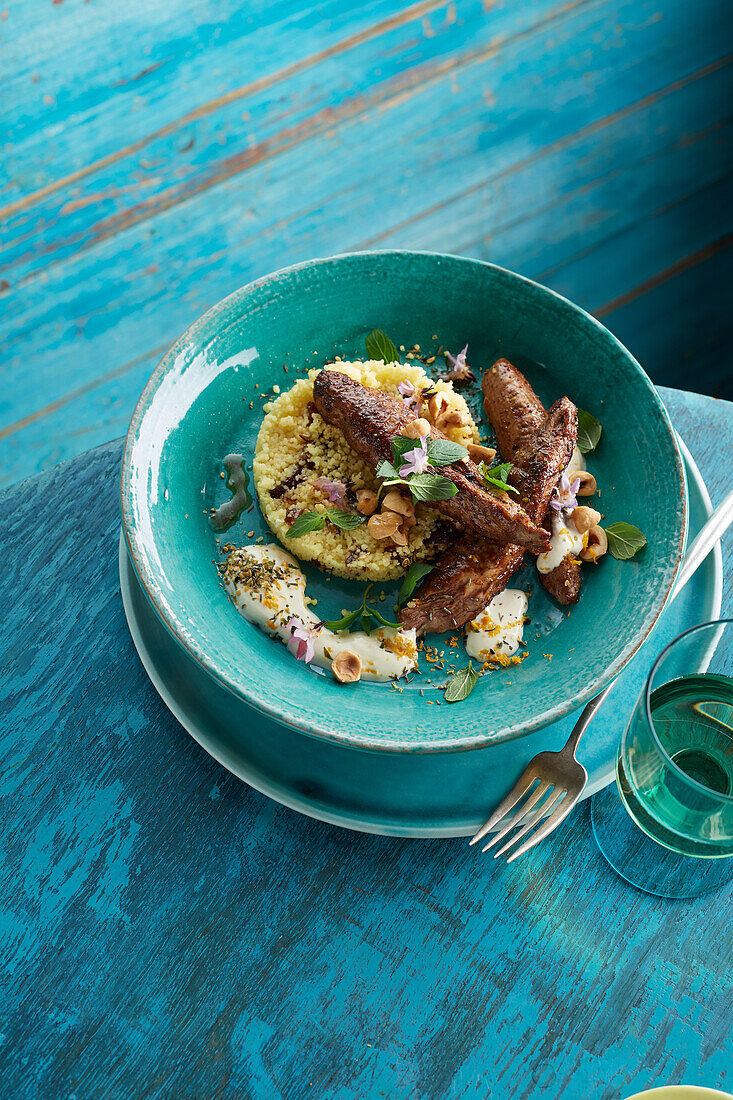 Grilled Baharat lamb fillets and couscous with dates