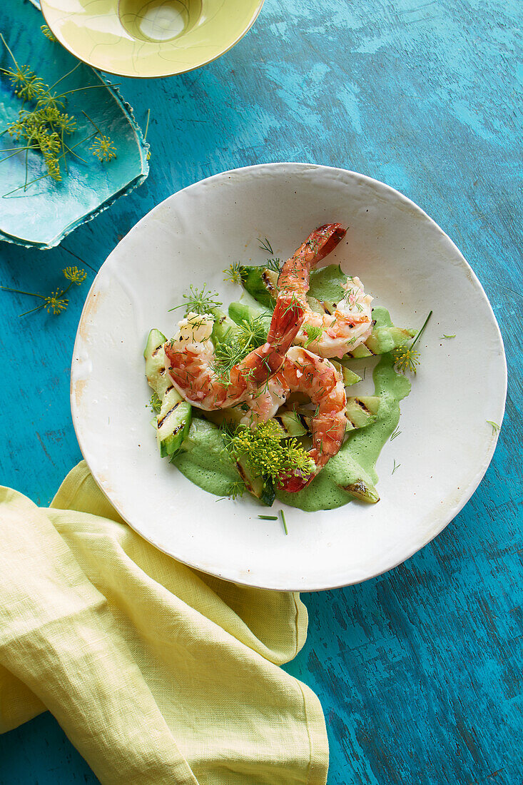 Prawns with warm dill vinaigrette and grilled cucumber