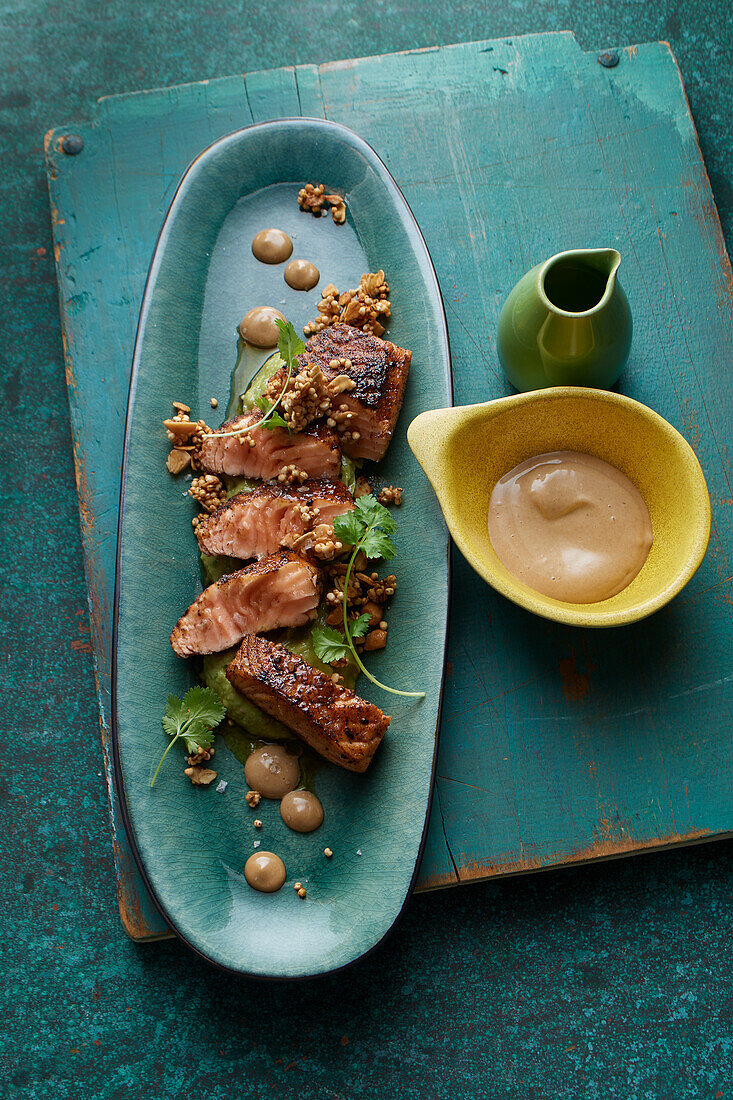 Spicy roasted Cajun salmon with avocado cream and aioli