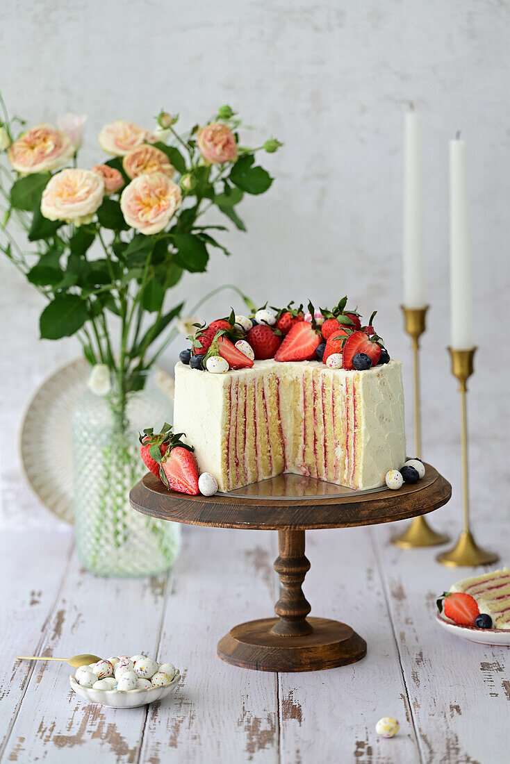 Strawberry tart with vanilla quark cream, macarons and fresh berries