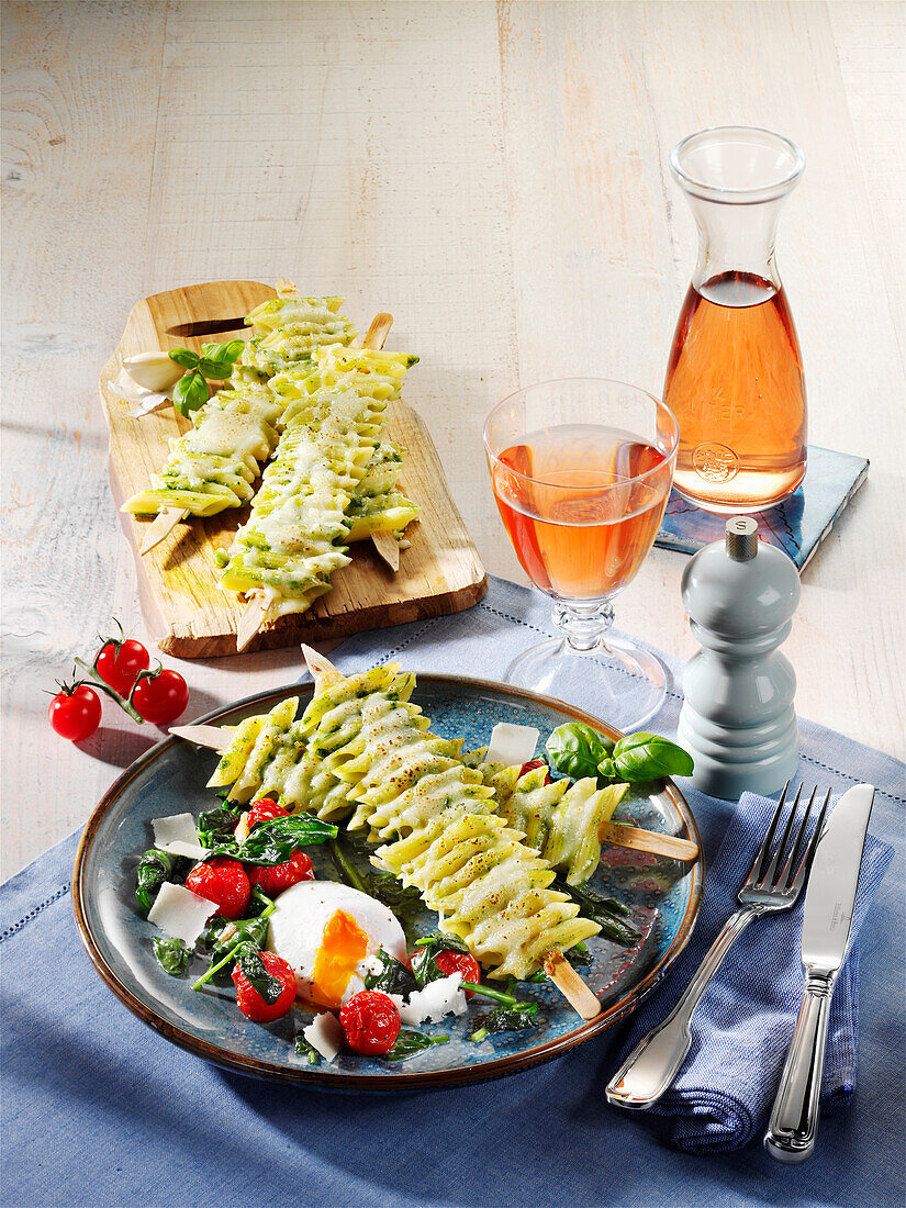 Penne skewers on melted tomatoes