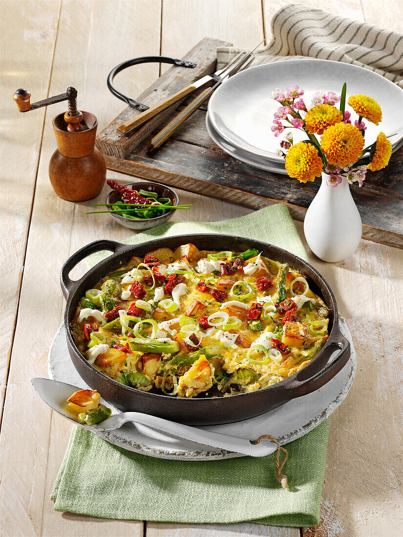 Asparagus frittata with potatoes, courgettes and mozzarella
