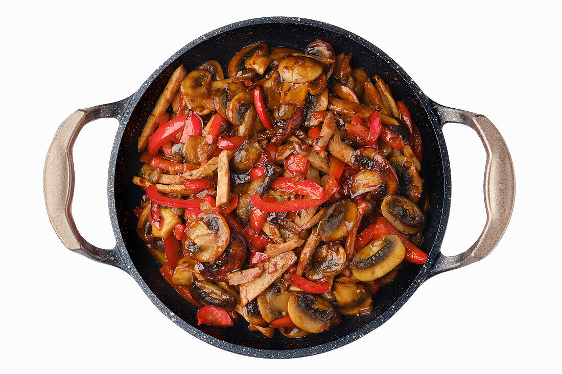 Pan with fried mushrooms, peppers and onions