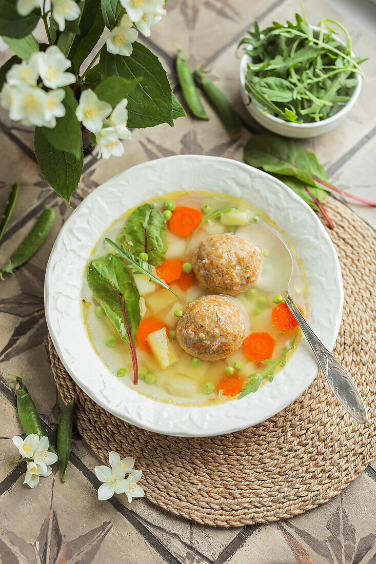 Vegetable soup with meatballs and herbs