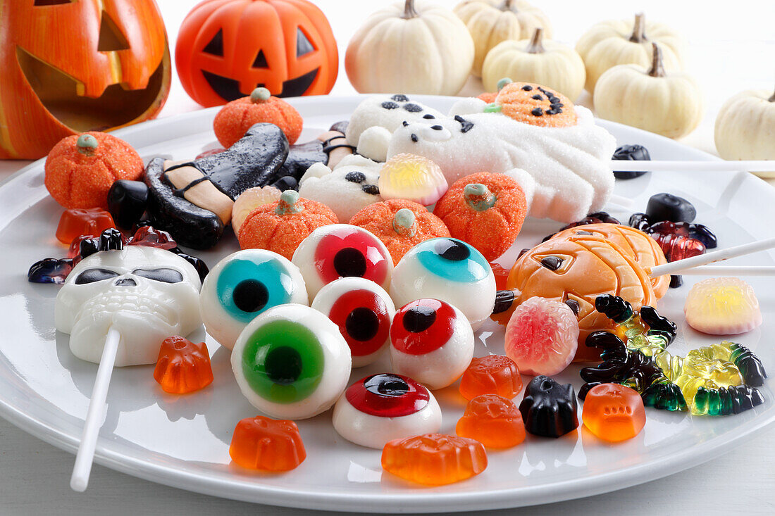 Candy selection for Halloween with pumpkin decoration