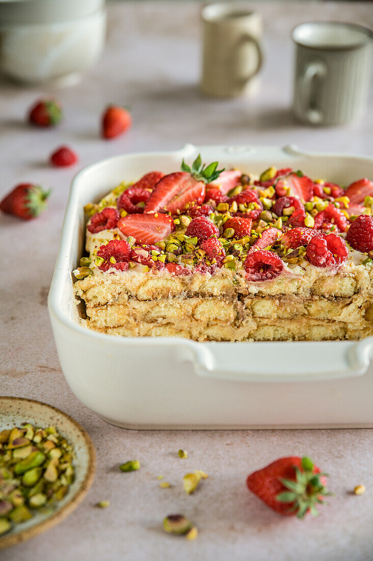 Strawberry and raspberry tiramisu with pistachios