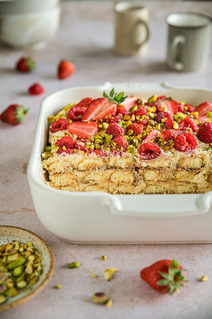 Tiramisu dessert with strawberries, raspberries and pistachios