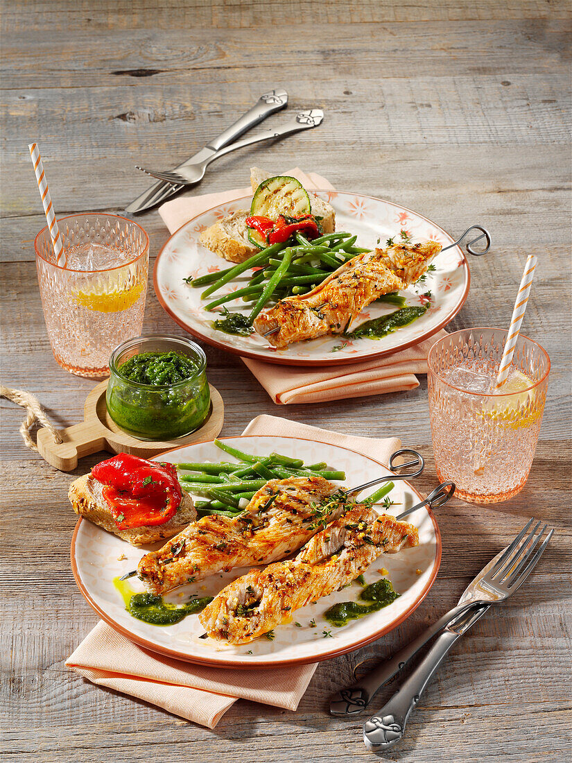 Grilled turkey skewers with almond and herb pesto