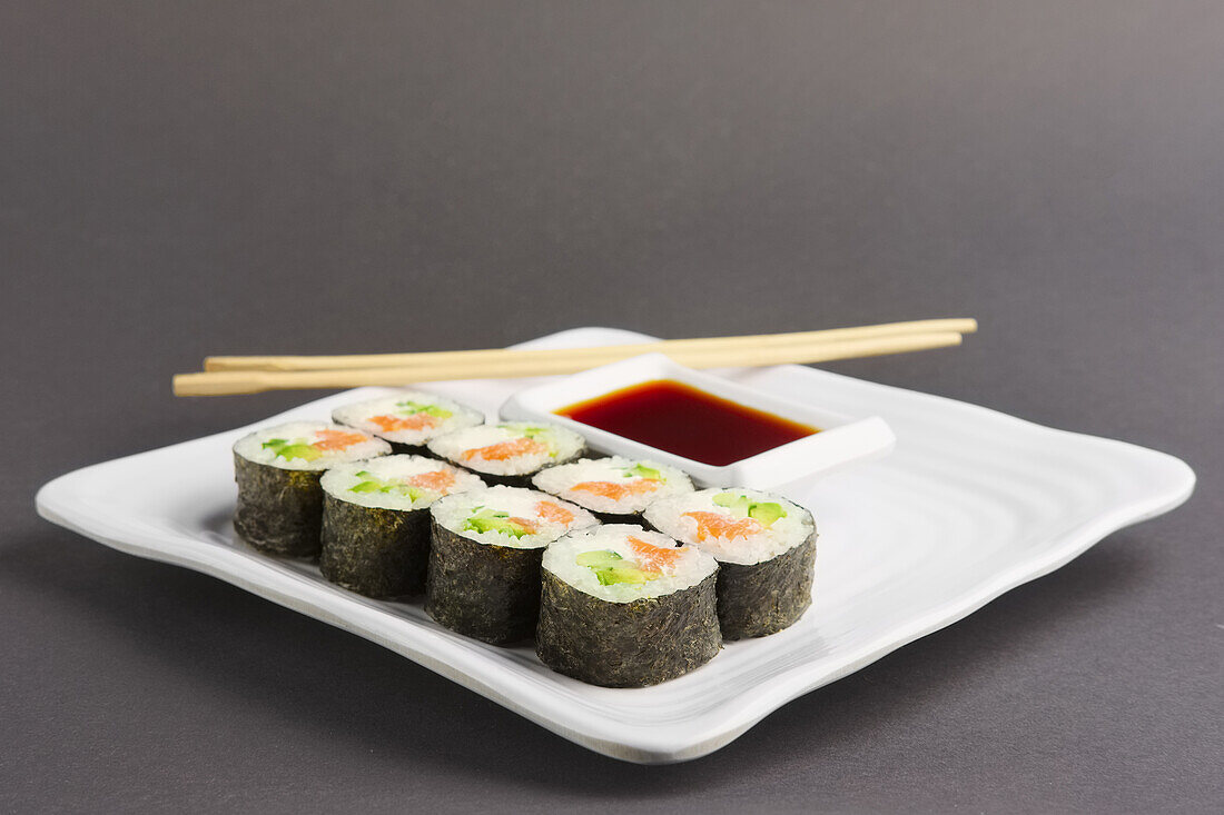 Maki sushi with salmon, avocado and cucumber