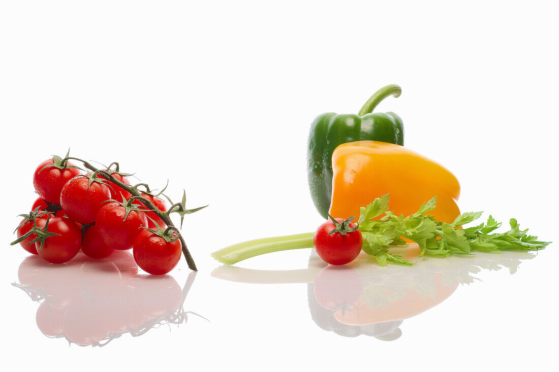 Tomatoes on the vine, celery and peppers