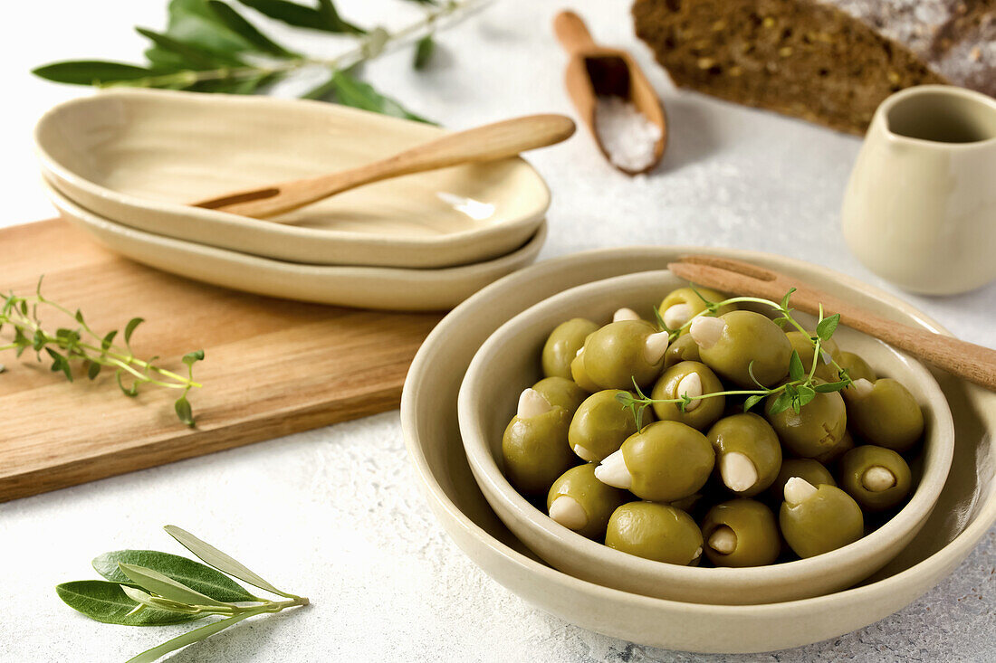 Green olives filled with almonds in small bowls