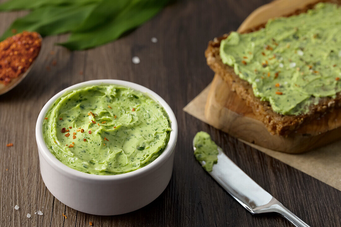 Wild garlic butter with Aleppo pepper on rye bread