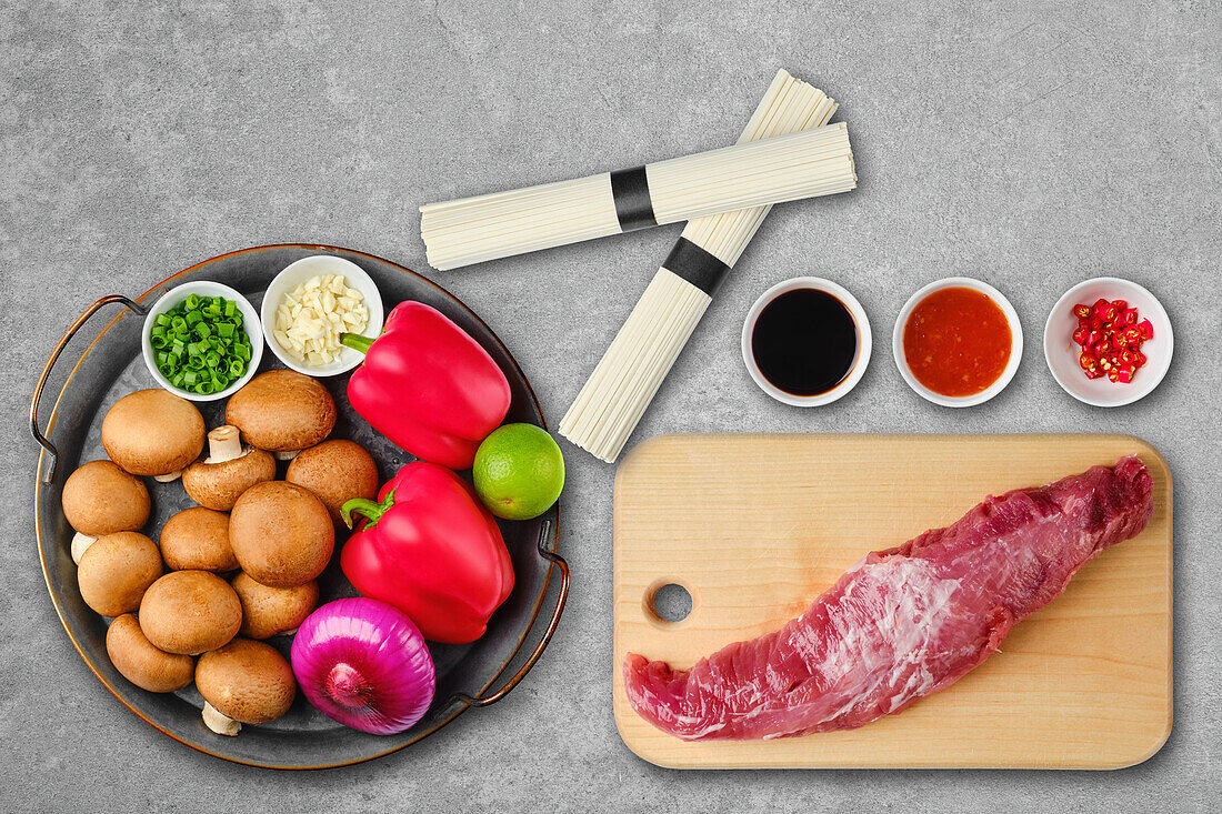 Ingredients for udon noodles with pork fillet and vegetables