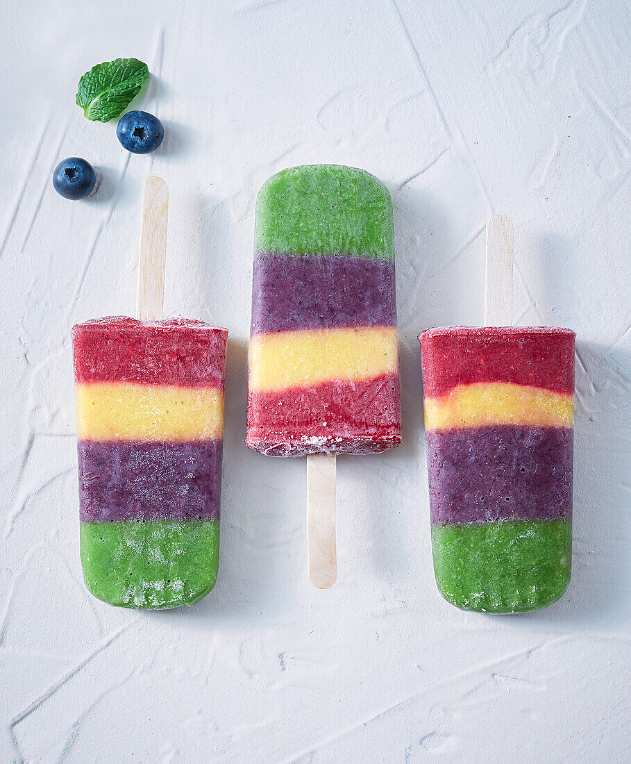 Rainbow fruit ice cream on a stick