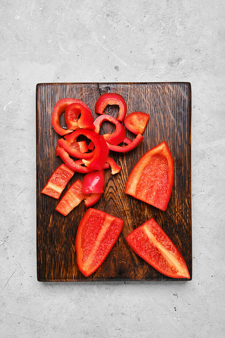 Pieces of red pepper on a chopping board