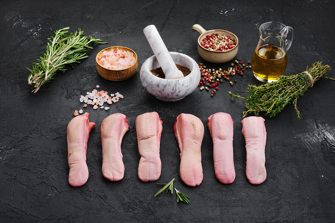 Raw lamb tongues with herbs and spices