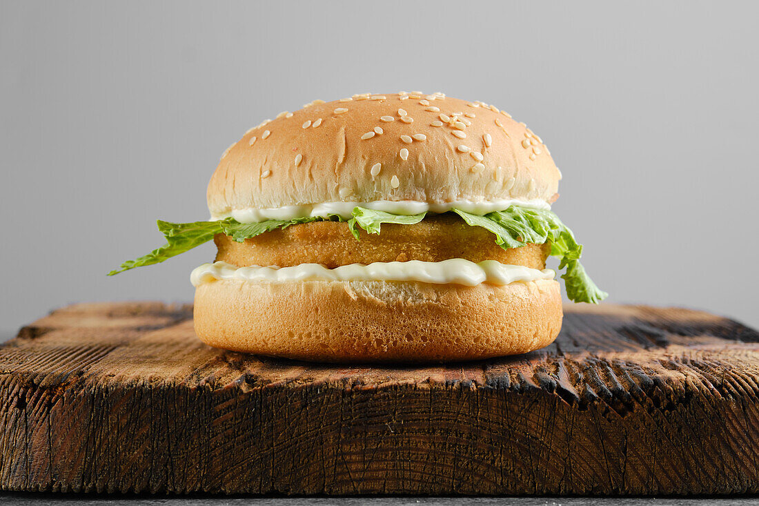 Chicken burger with iceberg lettuce and mayonnaise