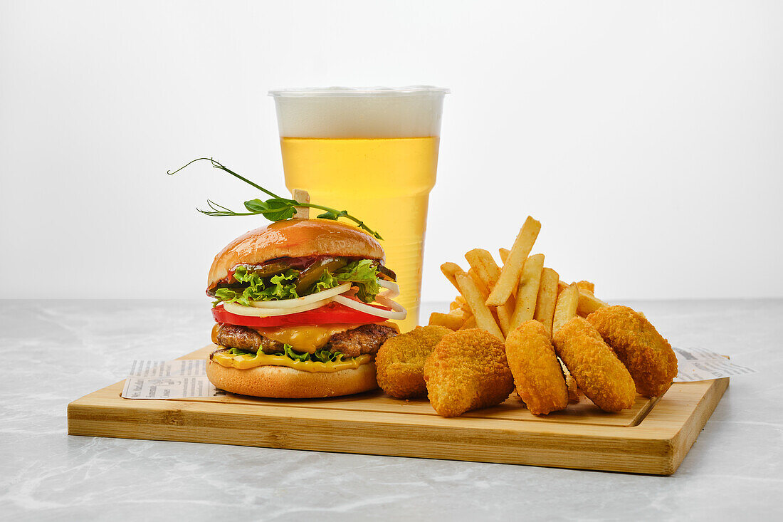 Hamburger and chicken nuggets with fries