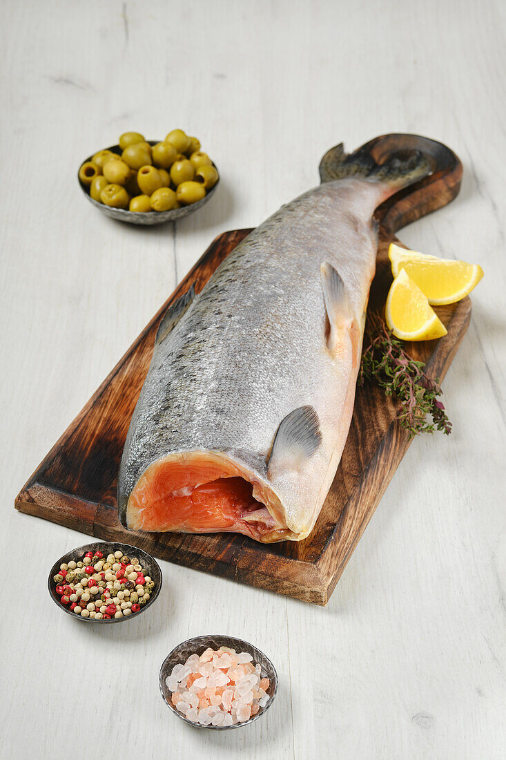 Raw ready-to-cook Chinook salmon on a chopping board