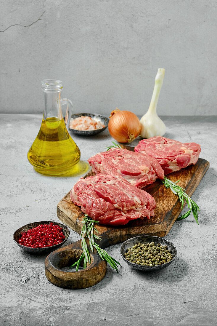 Raw lamb neck chops with rosemary and spices