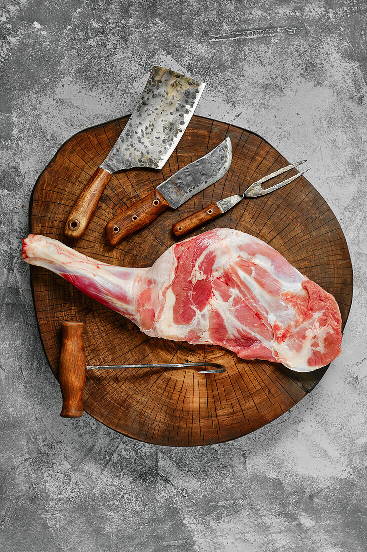 Raw lamb shoulder on cutting board