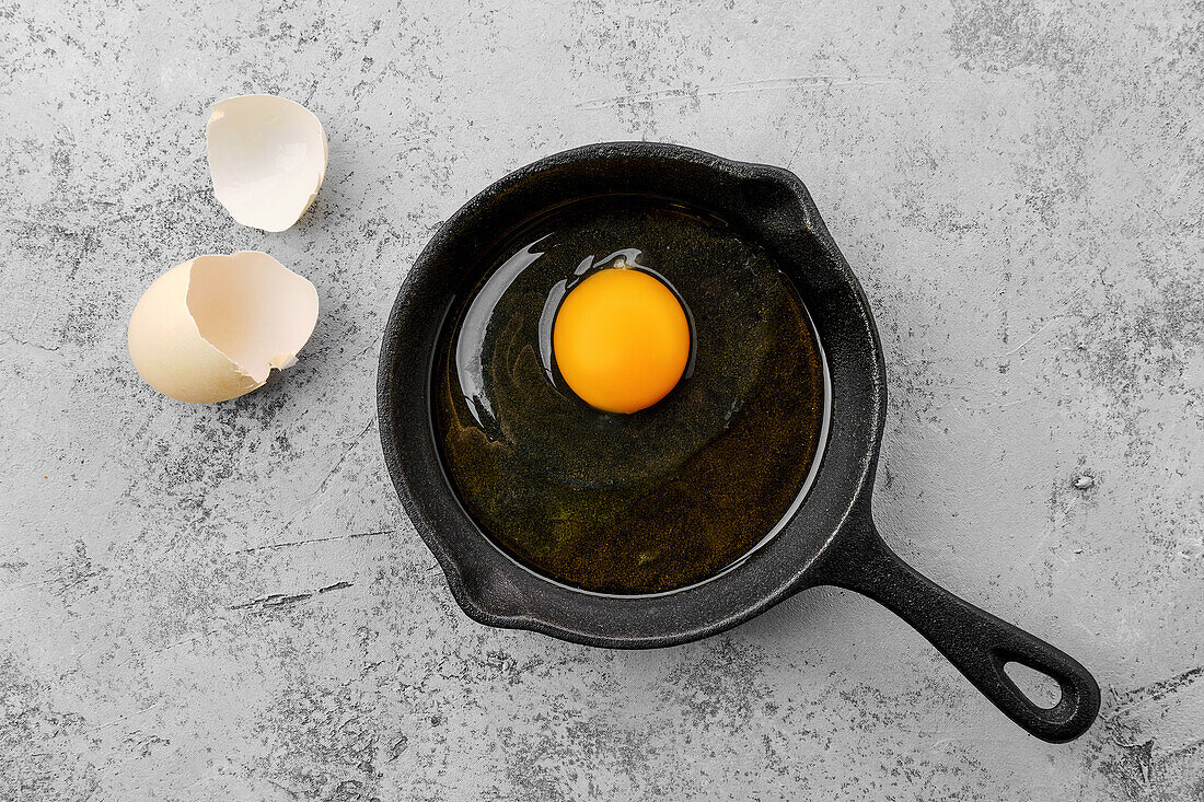 Fry a fried egg in a small pan