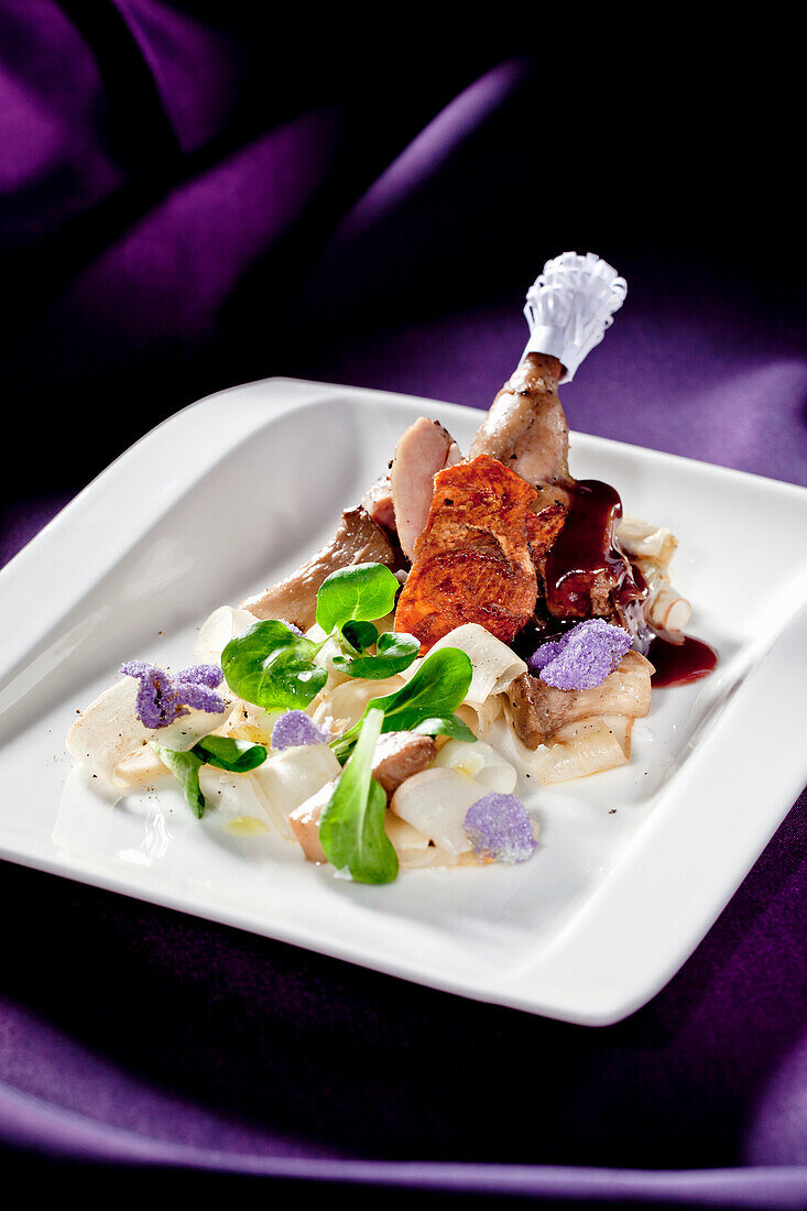 Partridge with black salsify papardelle, lamb's lettuce and candied violets