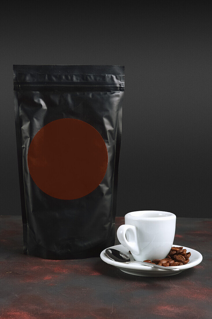 Espresso with coffee beans and packet of coffee