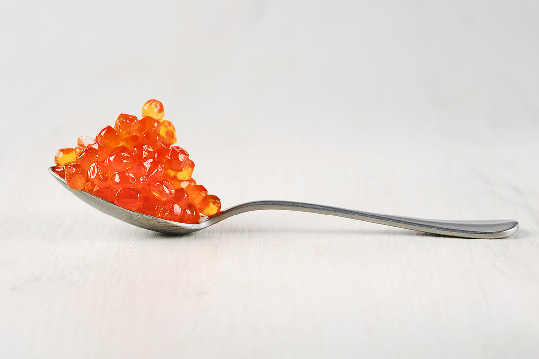 Salmon caviar on a spoon