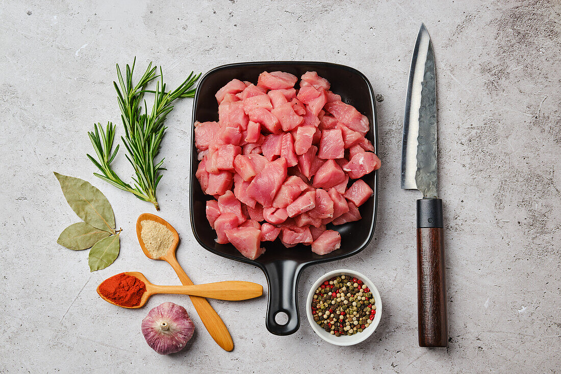 Raw pork goulash with spices and herbs