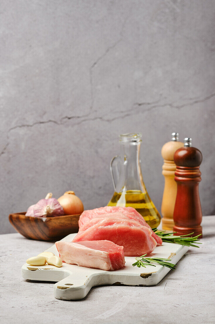 Raw pork loin roast with rosemary and garlic