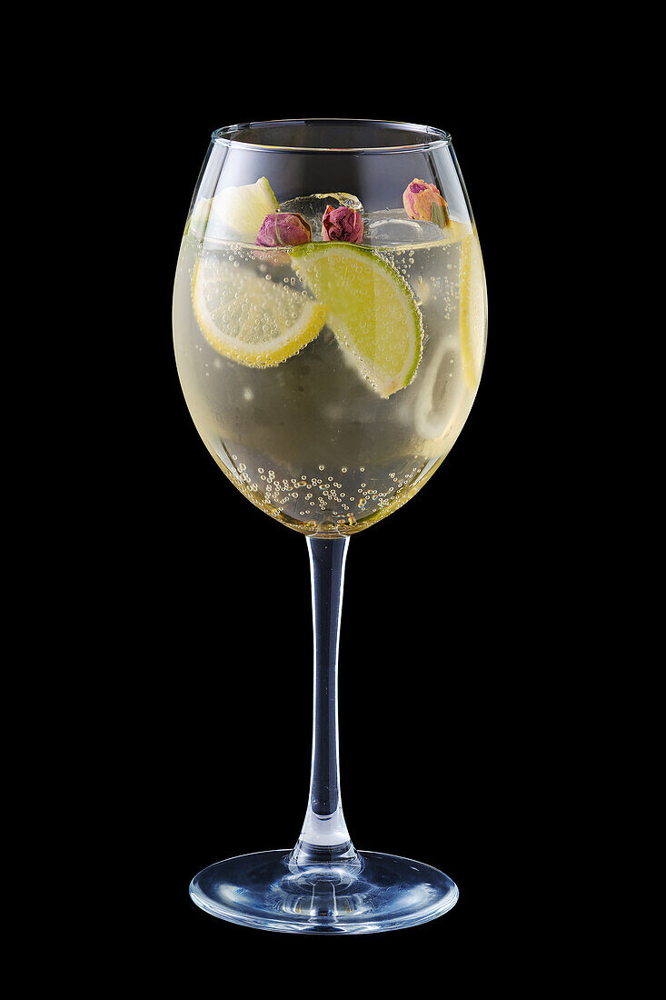 White sangria with lime, lemon and rosebuds