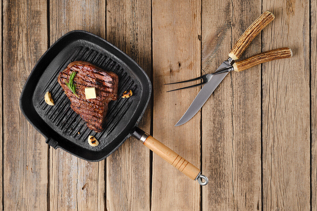 Chuck eye steak with butter and garlic