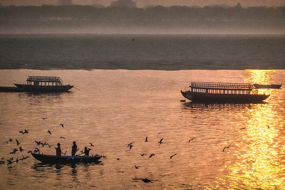 Boats on Ganges River at sunset, Varanasi, Uttar Pradesh, India