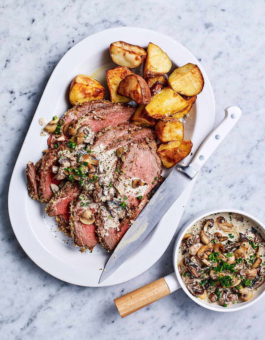 Roast beef with herb crust and creamy mushroom sauce