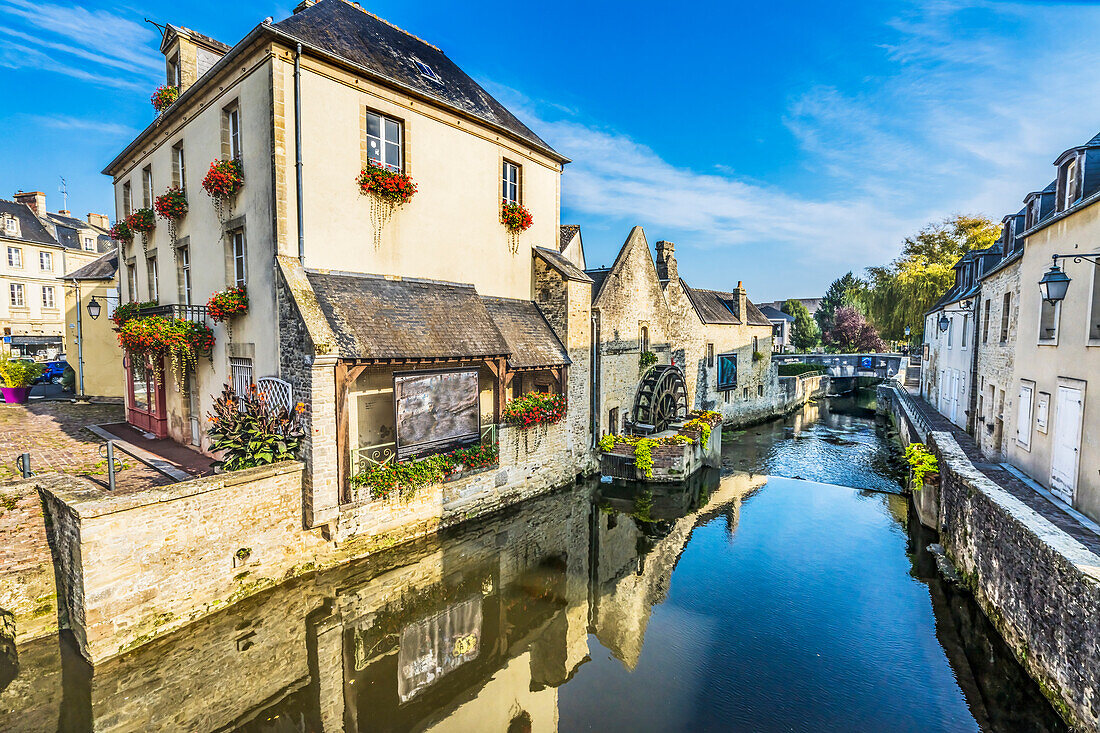 Colorful old buildings, Aure River reflection, Bayeux, Normandy, France. Bayeux founded 1st century BC, first city liberated after D-Day