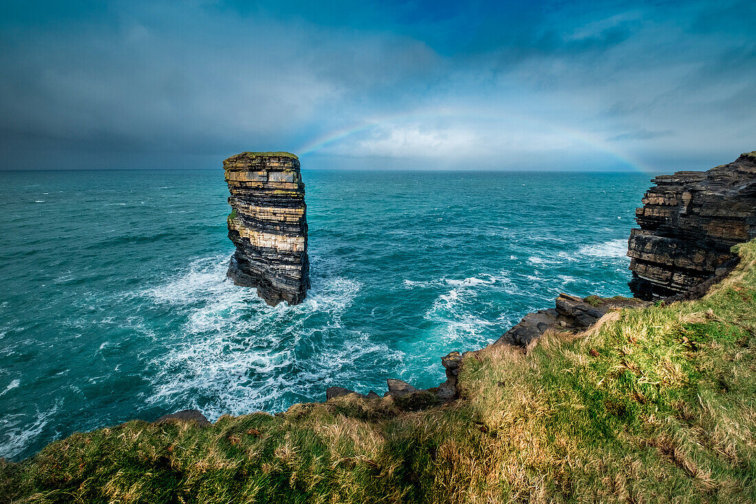 Dun Briste Sea Stack resists the onslaught of the stormy Atlantic Ocean, County Mayo, Ireland.