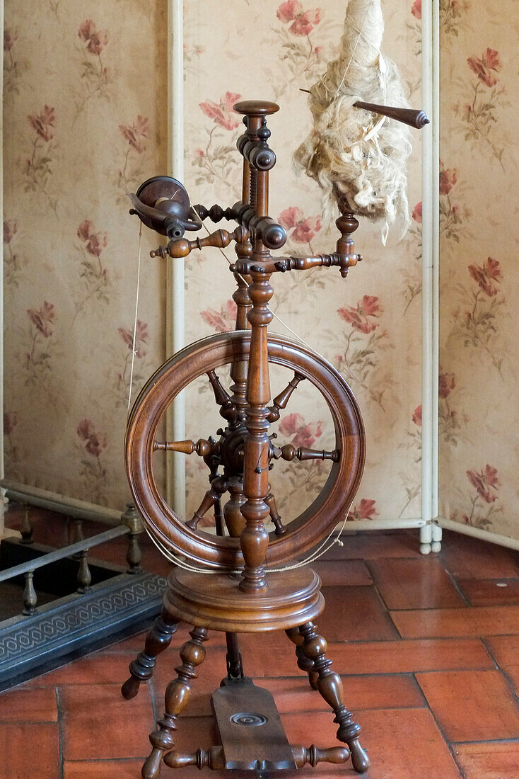 Sintra, Portugal. National Palace interior. Spinning wheel by the fireplace (Editorial Use Only)
