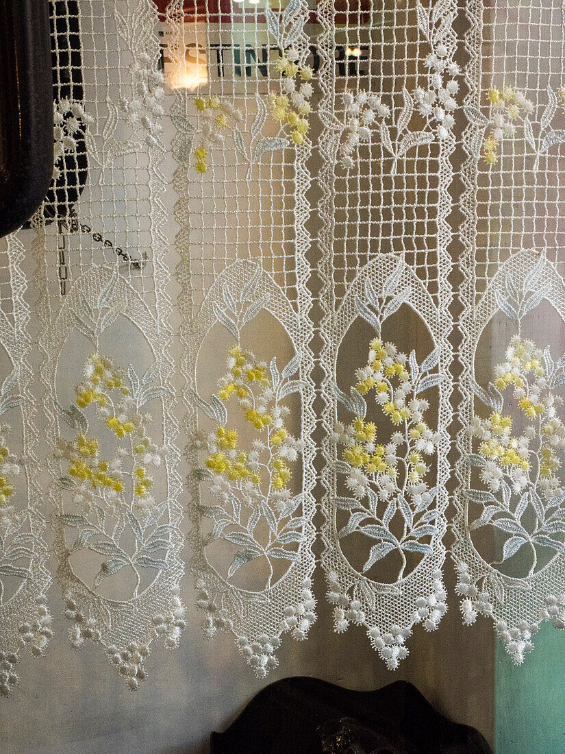 Italy, Tuscany, Province of Siena, Montalcino. Pretty lace curtains.