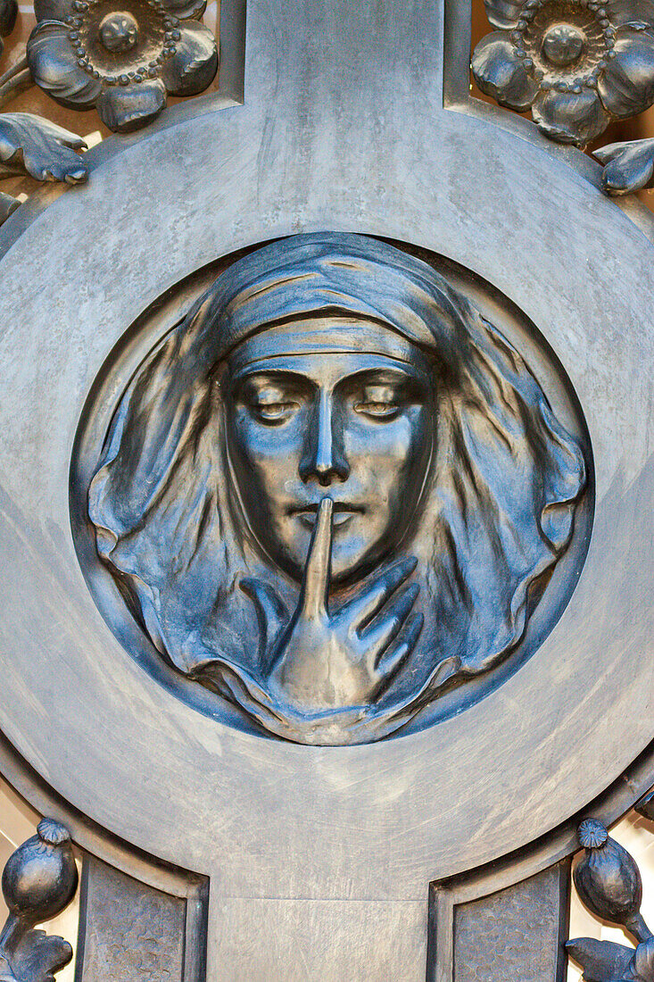 Argentina, Buenos Aires. Recoleta Cemetery. Relief of a woman's face.