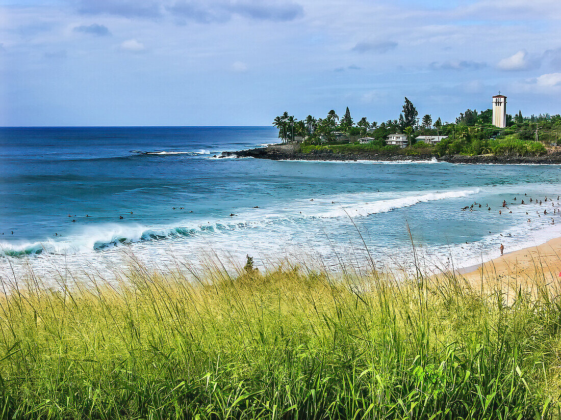 Surfers Waimea Bay North Shore, Oahu, Hawaii. Waimea is relatively flat until the winter months